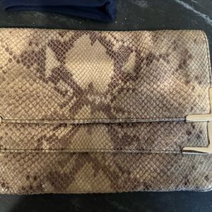 11x7.5h. 100 percent genuine leather snakeskin clutch